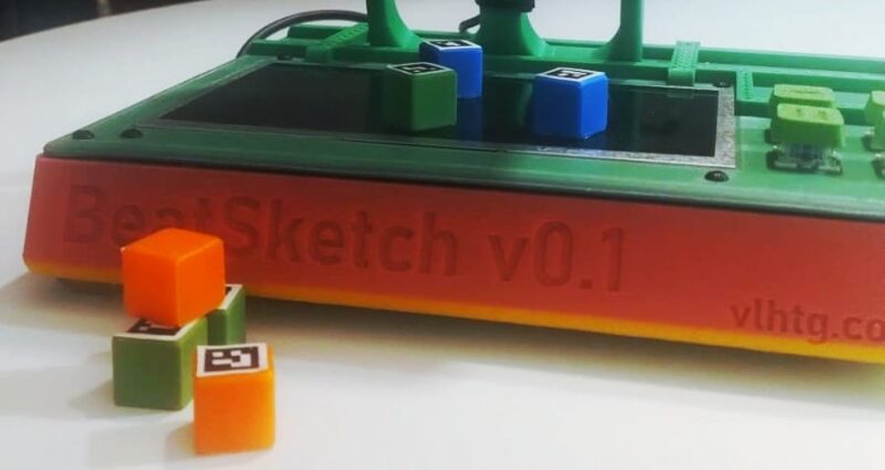 BeatSketch device with a few colored cubes in front of it