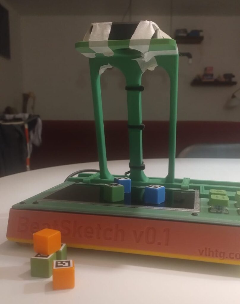 Image of the BeatSketch device from the front, showing it almost entrely, with a few cubes.